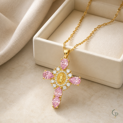 Pink teardrop halo pendant necklace beside an unbranded ivory jewelry box