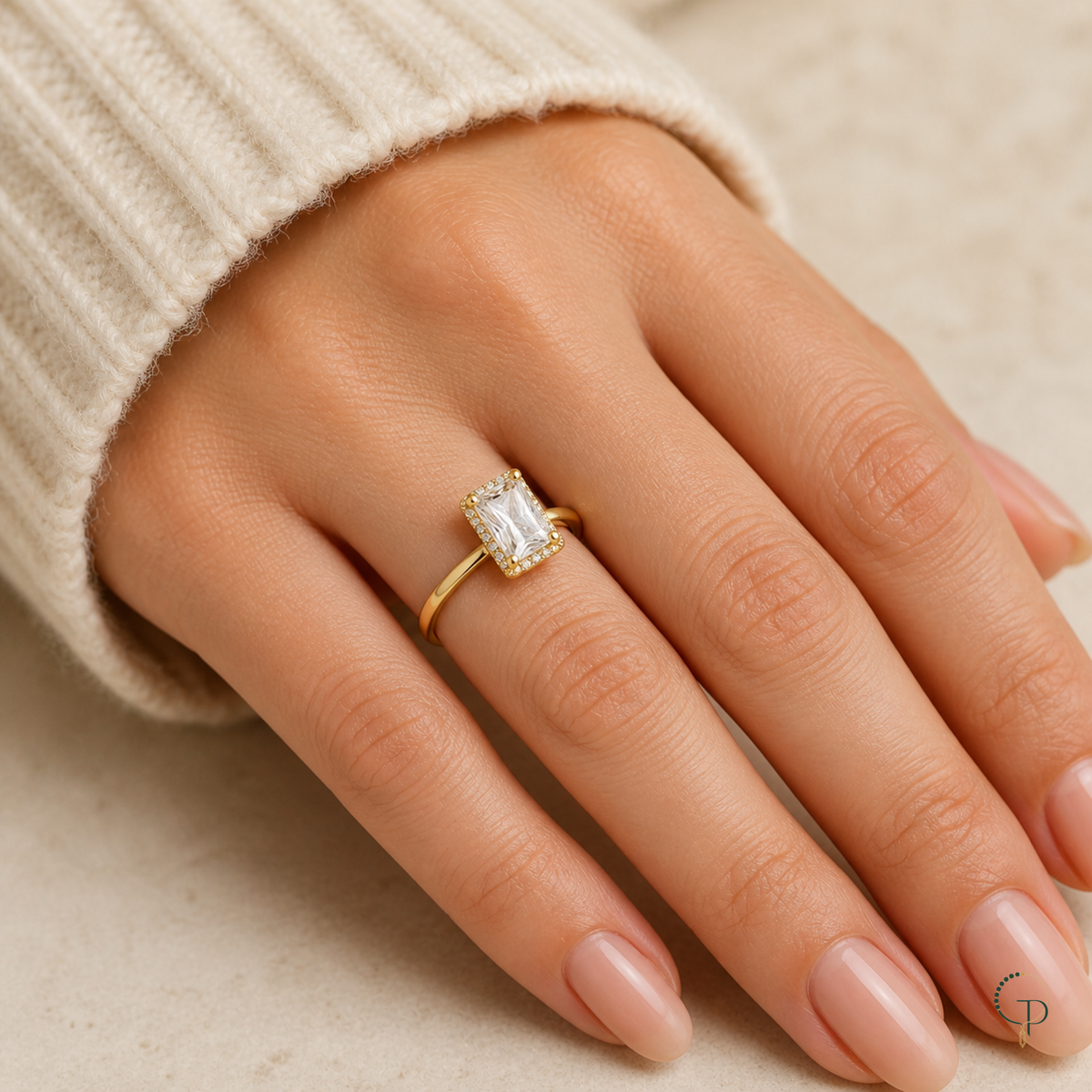 Rectangle-stone solitaire ring worn alone on an anonymous hand