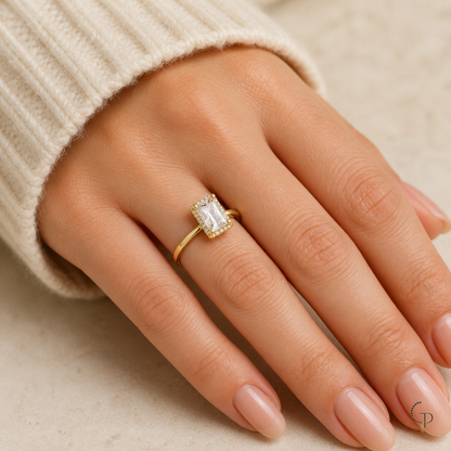 Rectangle-stone solitaire ring worn alone on an anonymous hand