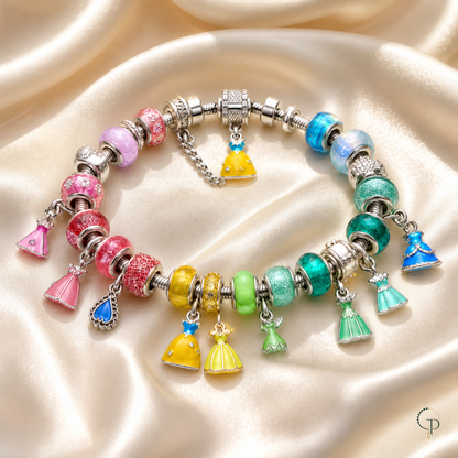 Colorful glass bead charm bracelet styled on cream satin
