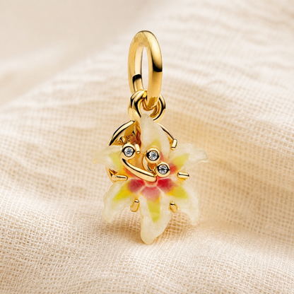 Close-up of layered enamel flower pendant charm with crystal face details