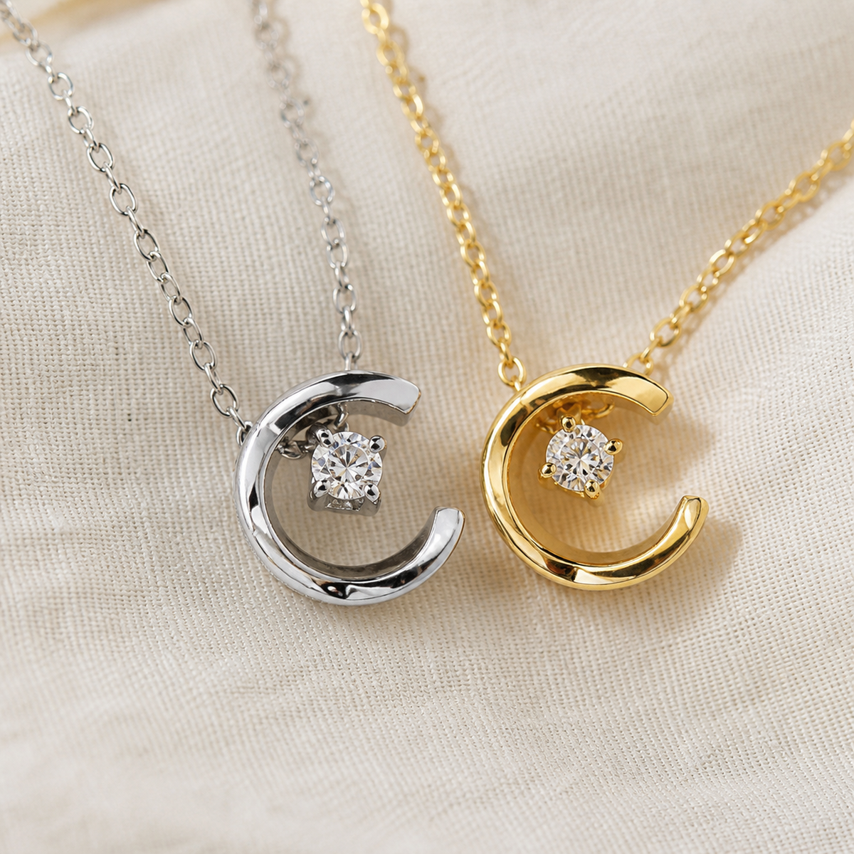 Close-up of gold and silver crescent moon crystal pendants
