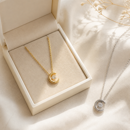 Gold and silver crescent moon necklaces with an ivory jewelry box