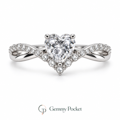 Silver-color heart ring with intertwined polished and stone-accented shoulders on a white background.