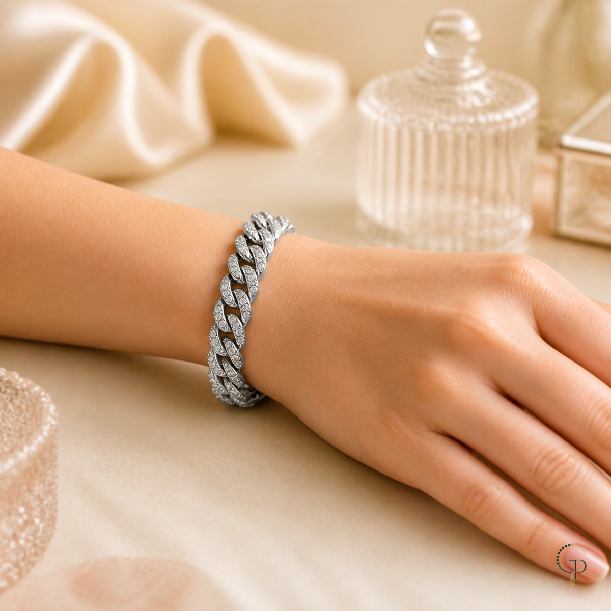 Silver-color Cuban link bracelet shown at wrist scale