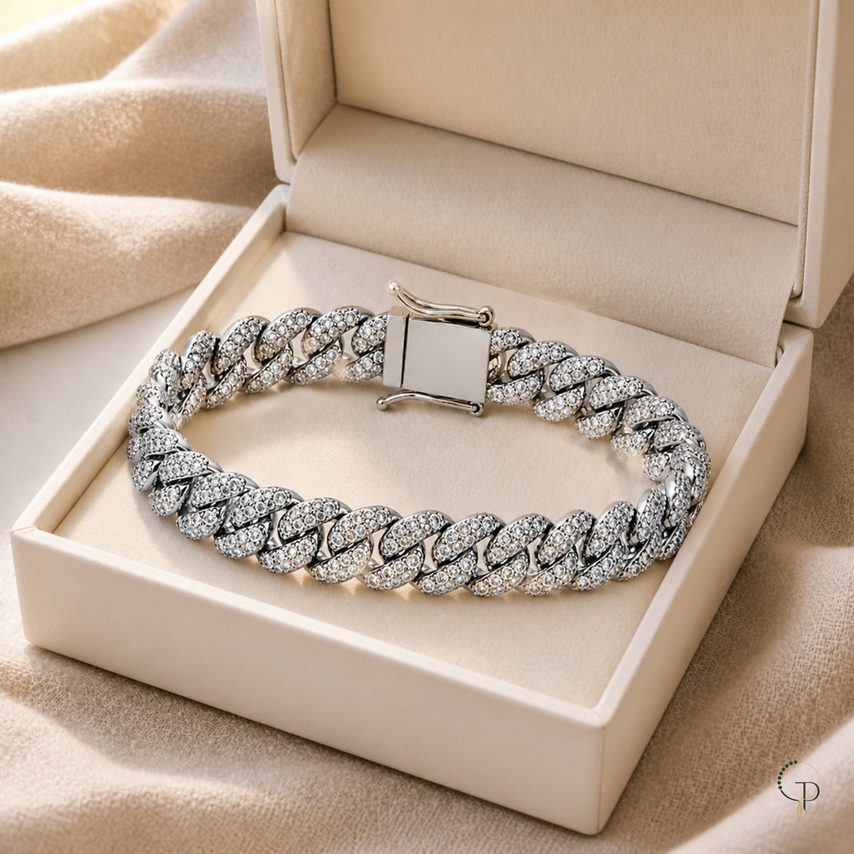Silver-color pavé Cuban link bracelet in an unbranded ivory box