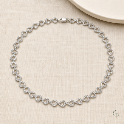 Full silver-color heart link collar necklace arranged on oatmeal linen