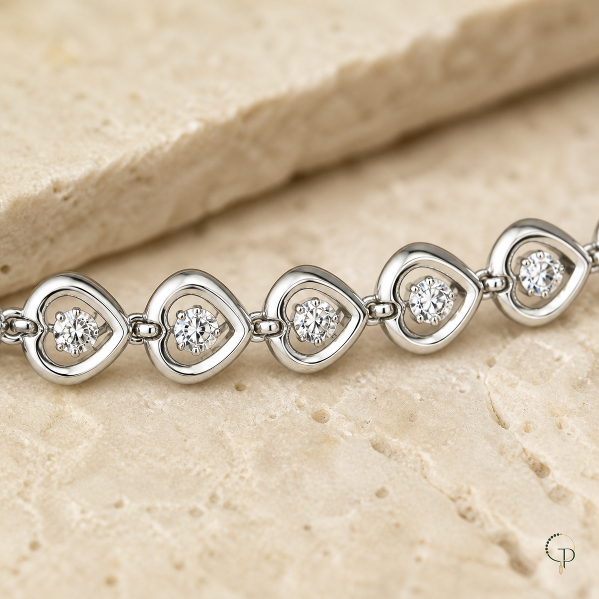 Close view of open heart links with one clear crystal in each