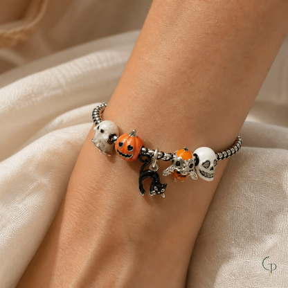 Pumpkin and black cat silver-color charm bracelet worn on wrist
