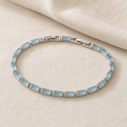 Full light blue rectangular stone tennis bracelet on ivory fabric