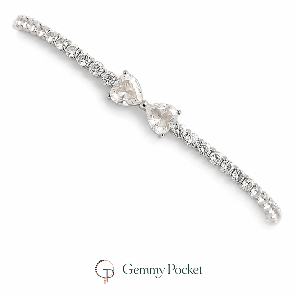 Silver-color twin heart bow tennis bracelet on a white studio background