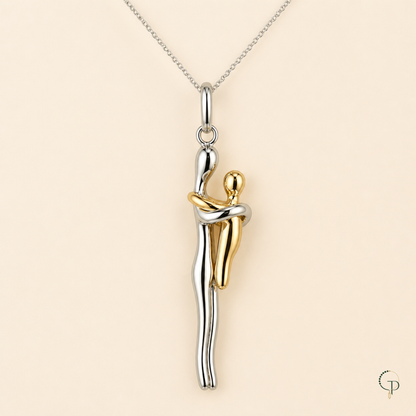 Close detail of the oval bail, fine chain and crossed embracing arms