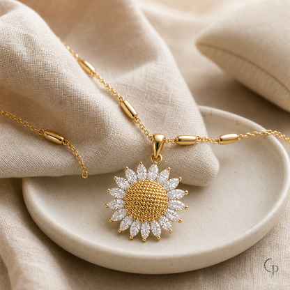 Sunflower pendant necklace styled on ivory ceramic and oatmeal linen