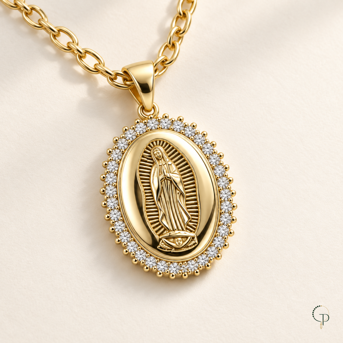 Angled detail of the medallion bail and gold-tone chain links