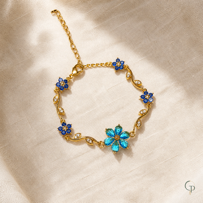 Blue floral vine bracelet with aqua and deep-blue flowers on oatmeal linen
